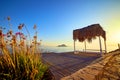 Bungalow on the sea at sunset. Wooden pavilions on the shore of a sandy beach - Bodrum, Turkey Royalty Free Stock Photo