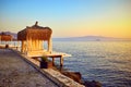 Bungalow on the sea at sunset. Wooden pavilions on the shore of a sandy beach - Bodrum, Turkey Royalty Free Stock Photo