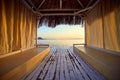 Bungalow on the sea at sunset. Wooden pavilions on the shore of a sandy beach - Bodrum, Turkey Royalty Free Stock Photo