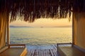 Bungalow on the sea at sunset. Wooden pavilions on the shore of a sandy beach - Bodrum, Turkey Royalty Free Stock Photo