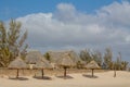 Bungalows on the beach with dry grass roof