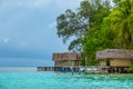 Bungalows on Stilts on the Shores of a Tropical Island