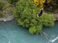 Bungee jumper hanging on rope face down.