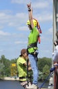 Bungee jumping. Girl standing on the bridge railing hands up ready to jump down Royalty Free Stock Photo