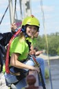 Bungee jumping. Girl standing on the bridge railing hands up ready to jump down Royalty Free Stock Photo