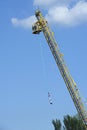 bungee jumping. Young woman jumping from the high rise tower crane. Royalty Free Stock Photo