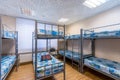 Bunk metal beds in hostel room Royalty Free Stock Photo