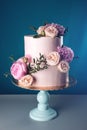 Pink cream wedding cake decorated with fresh roses Royalty Free Stock Photo