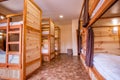 Bunk wooden beds in the hostel. Personal lighting over each bed. Royalty Free Stock Photo