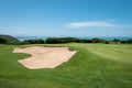 The bunker on the golf course and the sea in the background Royalty Free Stock Photo