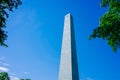 Bunker Hill Monument, an oblisk to commemorate the Battle of Bunker Hill, over green trees and blue sky, in Charlestown, Boston, Royalty Free Stock Photo