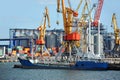 Bunker ship (fuel replenishment tanker) under port crane Royalty Free Stock Photo