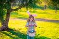 Bunny child. Easter bunny children. Kids boy in bunny ears hunting easter eggs in park outdoor.