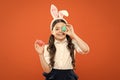 bunny is coming. small girl wear bunny ears. little kid in rabbit costume. spring holiday celebration. Easter eggs and