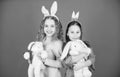 Bunny family. Children in rabbit bunny ears. Egg hunt. Family and sisterhood. Little girls with hare toy. family holiday Royalty Free Stock Photo