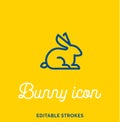 Bunny outline icon isolated on yellow background. Minimal animal icon set, lucky rabbit. Easter holiday bunny symbol with editable