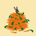 Bunny rabbit sitting in a pile of carrots