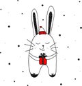 A bunny, a rabbit in a winter hat with a gift in his hand. Hand drawn doodle outline vector illustration. Black, white, red colors Royalty Free Stock Photo