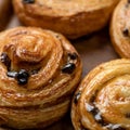 Buns with berries in sweet syrup, close up shot. Sweet pastries, dessert. Food concept. Square format or 1x1 for posting