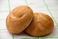 Buns on a green kitchen tablecloth Royalty Free Stock Photo