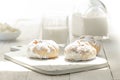 Buns, milk and cottage cheese on a white wooden breakfast table Royalty Free Stock Photo