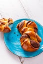 Buns with nutlet on a blue plate diagonal