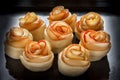 Buns-rosettes on a baking sheet, oiled. Bakery products