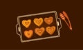 Buns in the shape of heart on baking tray with bakery tongs. Vector illustration. Isolated on dark background. Sweet