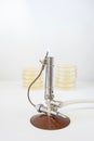 Bunsen burner with petri dishes Royalty Free Stock Photo