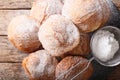 Bunuelos Mexican fritters sprinkled with powdered sugar close-up. horizontal top view Royalty Free Stock Photo