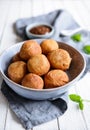 Bunuelos - traditional Colombian deep fried pastry with chocolate sauce Royalty Free Stock Photo