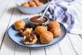 Bunuelos - traditional Colombian deep fried pastry with chocolate sauce Royalty Free Stock Photo