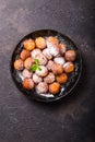 Bunuelos - traditional Colombian sweet deep fried pastry served with chocolate sauce Royalty Free Stock Photo