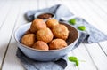 Bunuelos - traditional Colombian deep fried pastry with chocolate sauce Royalty Free Stock Photo