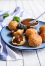 Bunuelos - traditional Colombian deep fried pastry with chocolate sauce Royalty Free Stock Photo