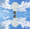 buon lamp with reflection on a vaste water Sea with White clouds Royalty Free Stock Photo