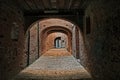 Buonconvento, Siena, Tuscany, Italy : the covered street Via Oscura in the old town Royalty Free Stock Photo