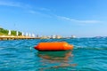 Buoy on the beach of the Aegean Sea. Selective focus. There is a place for your text. Royalty Free Stock Photo