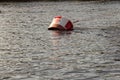 Buoy and bridle mooring red-white large anchor for large ships. Royalty Free Stock Photo