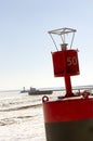 Buoy with The Crib and lighthouses on pier along shipping channel on frozen Lake Superior in Duluth, Minnesota Royalty Free Stock Photo