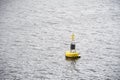 Buoy floating in water for demarcation of safe water depth Royalty Free Stock Photo
