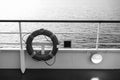Buoy or lifebuoy ring on shipboard in evening sea in miami, usa. Flotation device on ship side on seascape. Safety Royalty Free Stock Photo