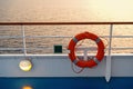 Buoy or lifebuoy ring on shipboard in evening sea in miami, usa. Flotation device on ship side on seascape. Safety