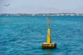 Buoy in the sea to mark the coral reef