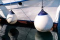 Mooring white buoys on fishing boat