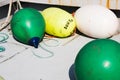 Buoys on boat deck- green, yellow, white Royalty Free Stock Photo