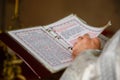 Buptism in russian church with book
