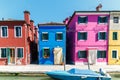 Burano island canal, colorful houses and boats, Venice Italy Europe