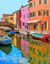 Burano island picturesque street with small colored houses, tourists on wooden bridge and beautiful water reflections Royalty Free Stock Photo