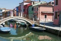 Burano island, Venice, Italy - view of canal, colorful houses, boats and a bridge Royalty Free Stock Photo